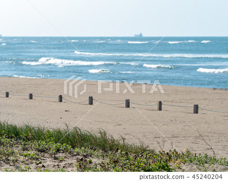 fences on sand beach 45240204