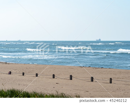 fences on sand beach 45240212
