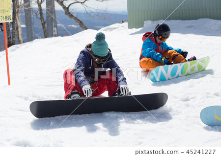 Parents and children putting bindings at the lift Parents and children putting bindings at the lift 45241227