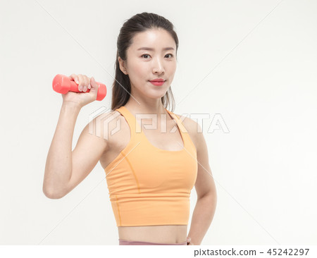 Korean woman exercising with dumbbells Korean woman exercising with dumbbells 45242297