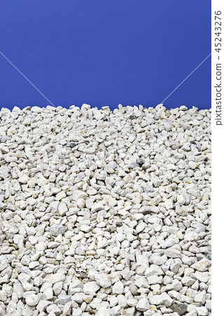 Blue wall with stones 45243276