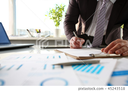 Silver pen lie at important paper on table in office Silver pen lie at important paper on table in office 45243518