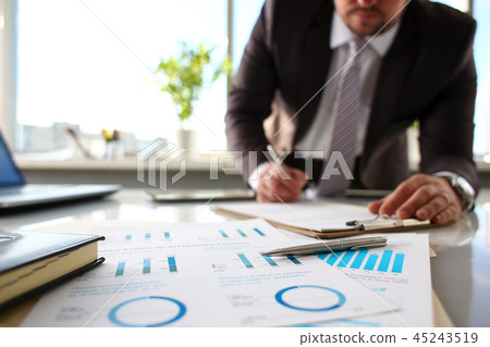 Silver pen lie at important paper on table in office Silver pen lie at important paper on table in office 45243519