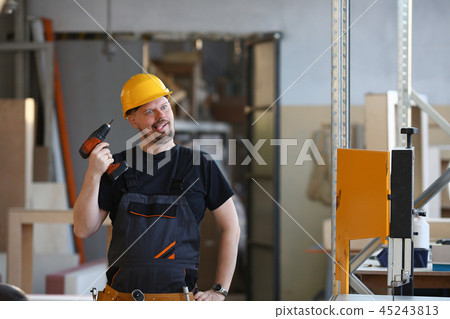 Idiot worker using electric drill portrait 45243813