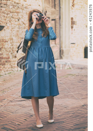 Girl with retro camera Girl with retro camera 45243976