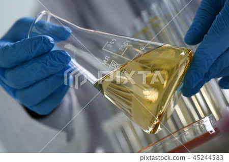 Yellow liquid spilled petrol additive innovative supply 45244583