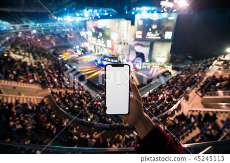 Woman's hands using digital application on the mobile smart phone at esport event at big arena. Copy Woman's hands using digital application on the mobile smart phone at esport event at big arena. Copy 45245113