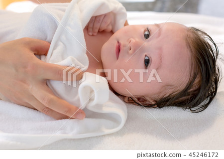 Baby boy taking a bath Baby boy taking a bath 45246172
