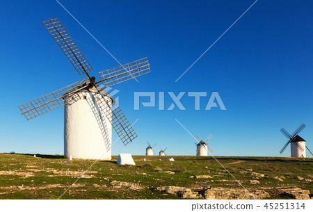 windmills in day time. Campo de Criptana windmills in day time. Campo de Criptana 45251314