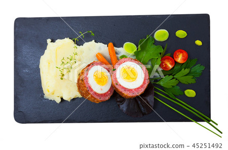 Top view of Scotch egg with mashed potatoes, vegetables, greens Top view of Scotch egg with mashed potatoes, vegetables, greens 45251492