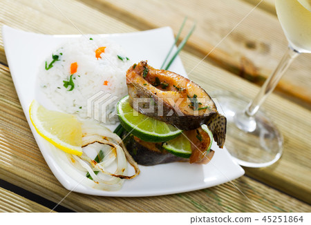 Baked trout steaks with white rice Baked trout steaks with white rice 45251864
