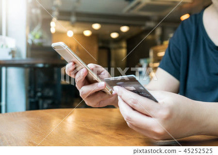 woman hand using smartphone for online shopping woman hand using smartphone for online shopping 45252525