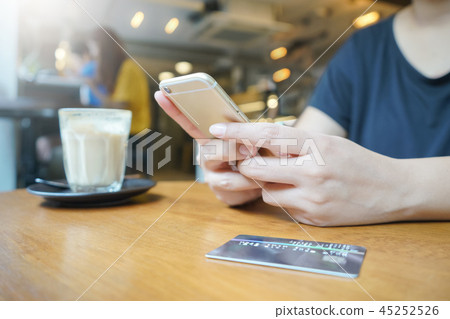 woman hand using smartphone for online shopping woman hand using smartphone for online shopping 45252526