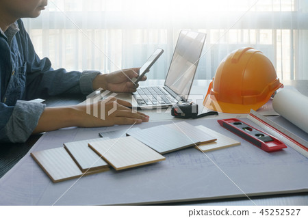 architect working on table with smart phone,laptop 45252527