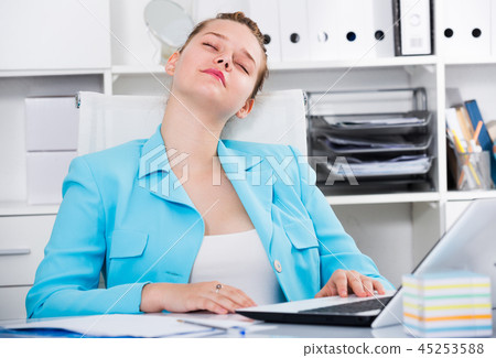Female employee is sleeping after productive day at work 45253588