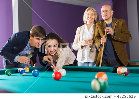 Laughing middle class people having pool game 45253629