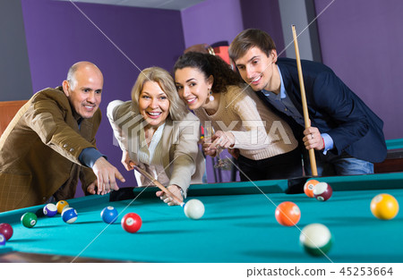Group of adults playing pool. 45253664