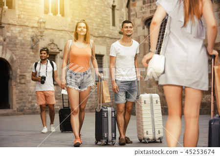 Ordinary couple in shorts with luggage 45253674