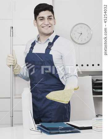 Cleaner is ready to clean the cabinet 45254032