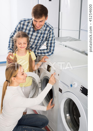 Positive family in store with electronics Positive family in store with electronics 45254600