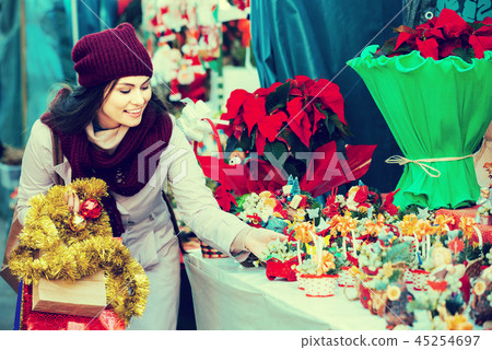 female customer choosing decorations female customer choosing decorations 45254697