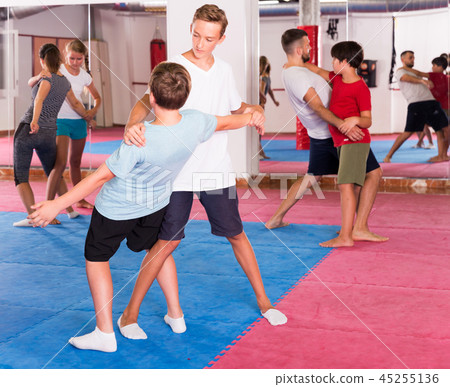 Kids exercising self-defense movements Kids exercising self-defense movements 45255136