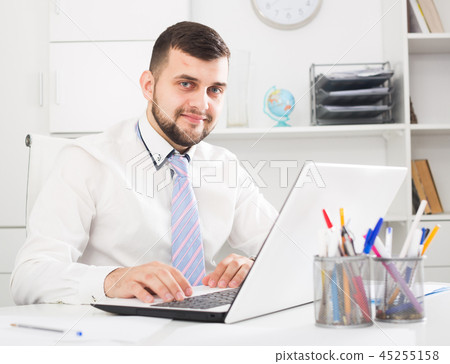 Man working productively Man working productively 45255158