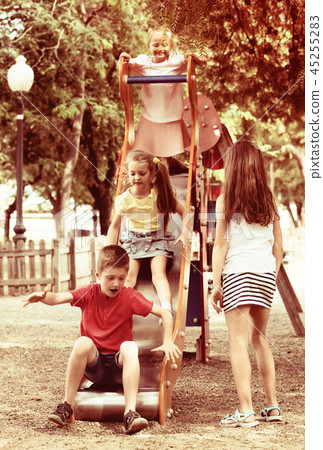Kids playing on sliding toy 45255283