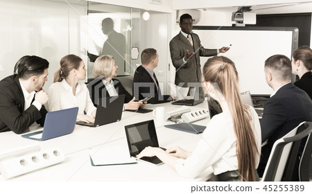 African American giving presentation to colleagues African American giving presentation to colleagues 45255389