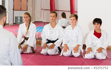 Kids taekwondo group ready to practice Kids taekwondo group ready to practice 45255752