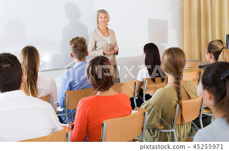 Students listening to lecture of female teacher 45255971