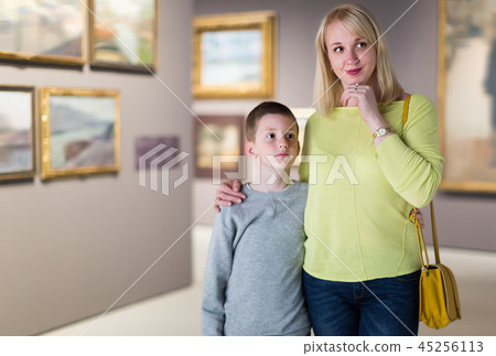 Cheerful mom and son exploring paintings Cheerful mom and son exploring paintings 45256113