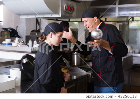 Chef dissatisfied with work of girl 45256118