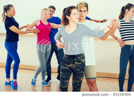Group of teen dancing salsa in dance studio 45256404