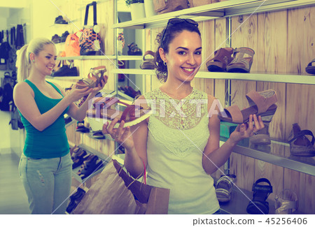 girl showing a chosen pair of shoes 45256406