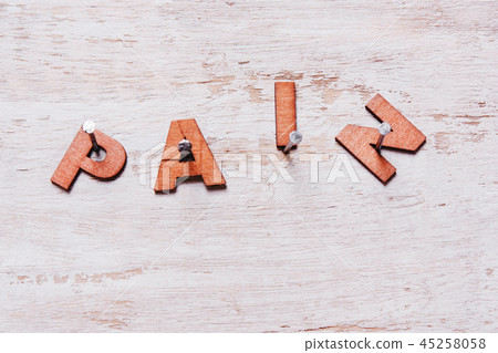 pain of wooden letters on a white background pain of wooden letters on a white background 45258058