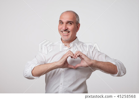 old european man making out of hands heart. 45258568