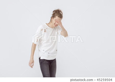 Cheerful smiling young male model in white t-shirt 45259504