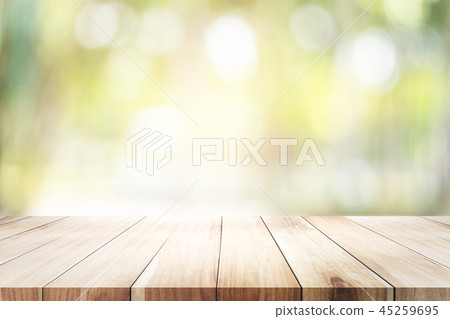 Empty table for present product with green bokeh. Empty table for present product with green bokeh. 45259695