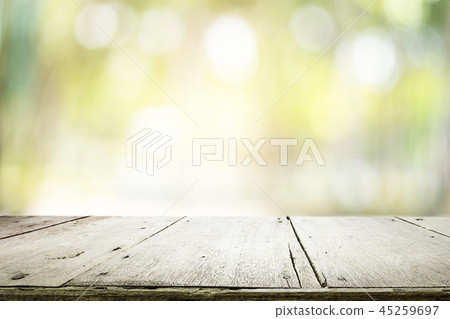 Empty table for present product with green bokeh. 45259697