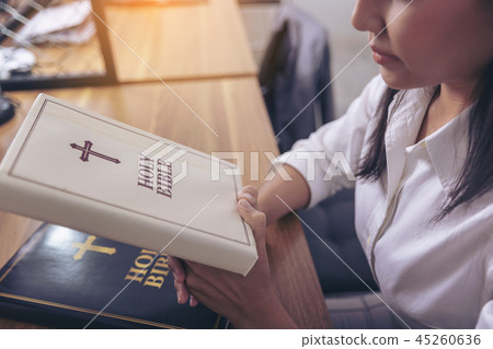 Women praying with bible Asian women believe Women praying with bible Asian women believe 45260636