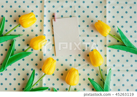Artificial yellow tulips with white paper card Artificial yellow tulips with white paper card 45263119