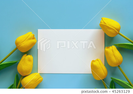 Artificial yellow tulips with white paper card Artificial yellow tulips with white paper card 45263129