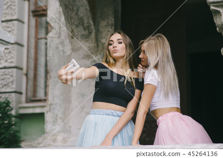 Girls with phone 45264136