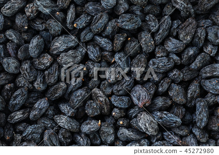 Black Raisin texture, popular dried fruit. Dried grapes. 45272980
