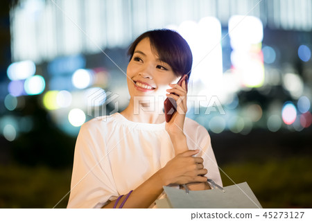 woman speak phone happily 45273127
