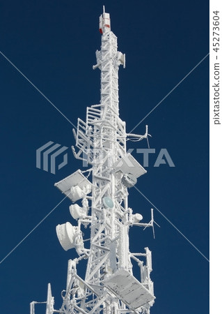 Transmitter tower frozen in winter frost 45273604