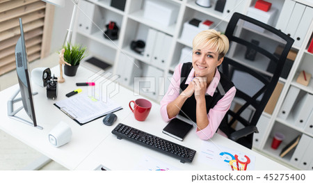 Portrait of a beautiful young girl in the office. Portrait of a beautiful young girl in the office. 45275400