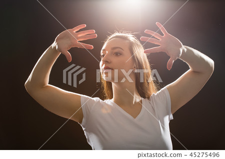 Hip-hop, jazz-funk, tecktonik, waacking, trance and street dances concept - Young woman dancing jazz Hip-hop, jazz-funk, tecktonik, waacking, trance and street dances concept - Young woman dancing jazz 45275496
