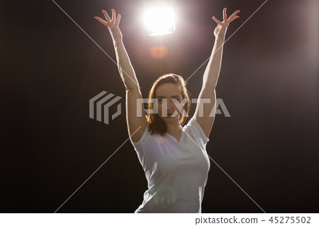 People and dancing concept - Young beautiful sporty woman dancing jazz funk on a black studio People and dancing concept - Young beautiful sporty woman dancing jazz funk on a black studio 45275502